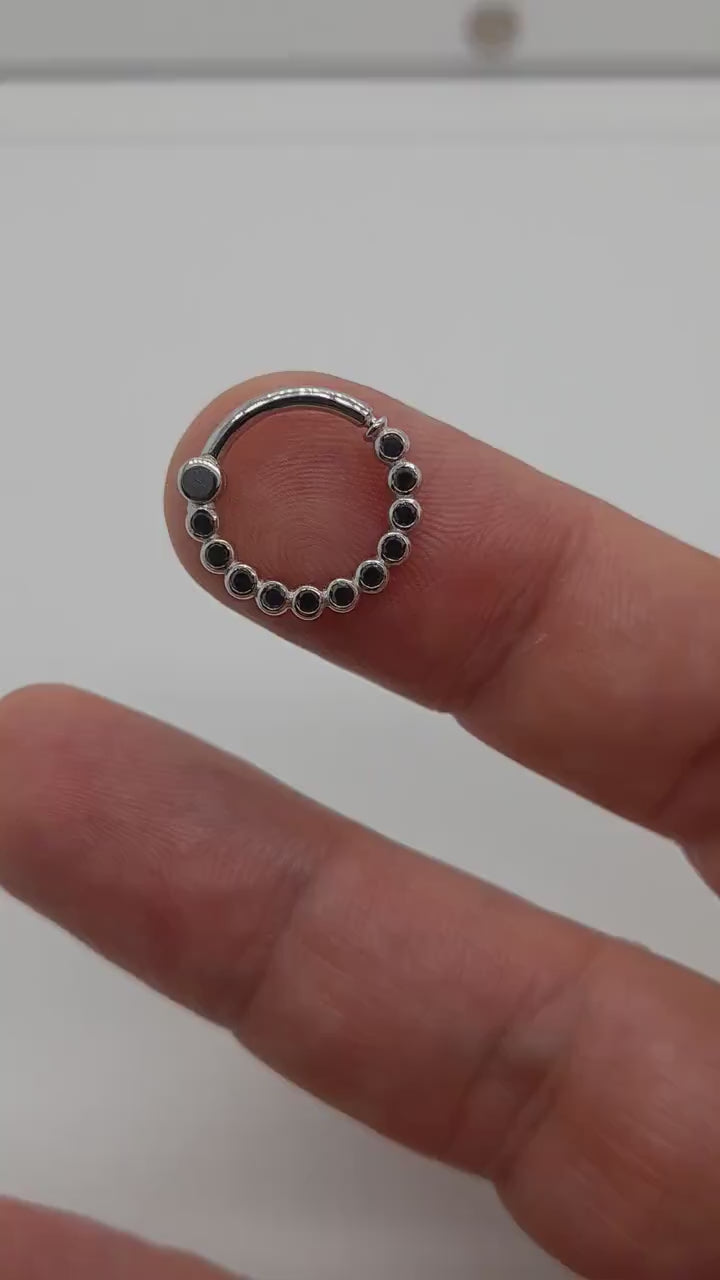 daith clicker in gold with black diamonds