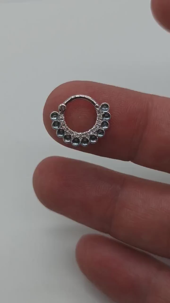 14k solid nose ring adorned with captivating Topaz Blue London stones. Perfect for septum piercings