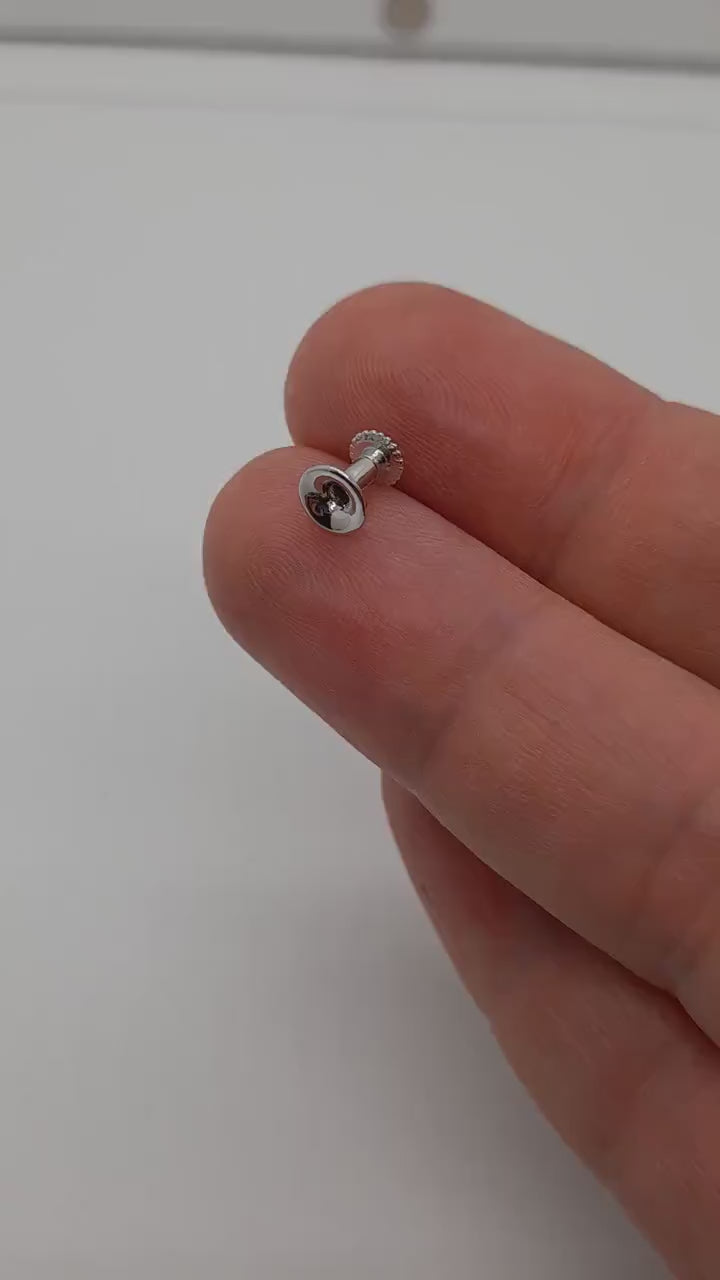 Gold stud piercing
