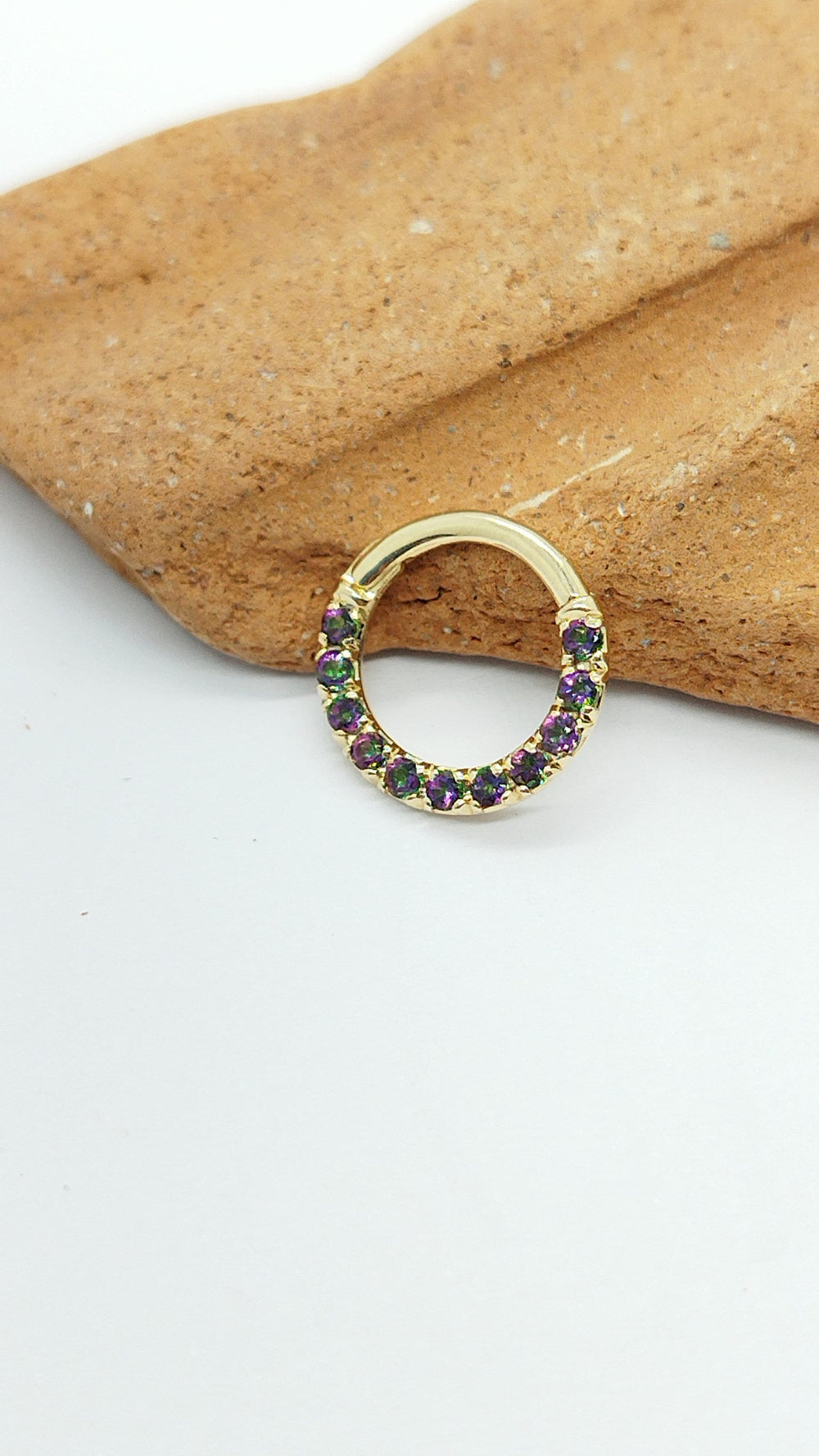 Mercury Mystic Topaz piercing