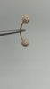 yebrow piercing - a 14k gold curved barbell adorned with exquisite white diamonds.