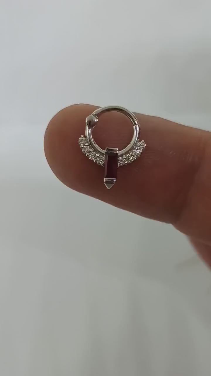 14k gold septum clicker with a luxurious ruby centerpiece and white diamond accents.